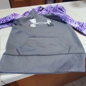 A under armour hoodie with some tears of silver